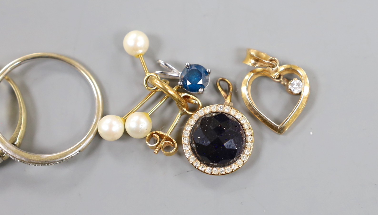 A modern platinum and solitaire diamond set ring, size G, gross weight 1.4 grams, four assorted 18ct gold and gem set rings including diamond chip half eternity and a pair of Italian 750 and cultured pearl earrings, gros